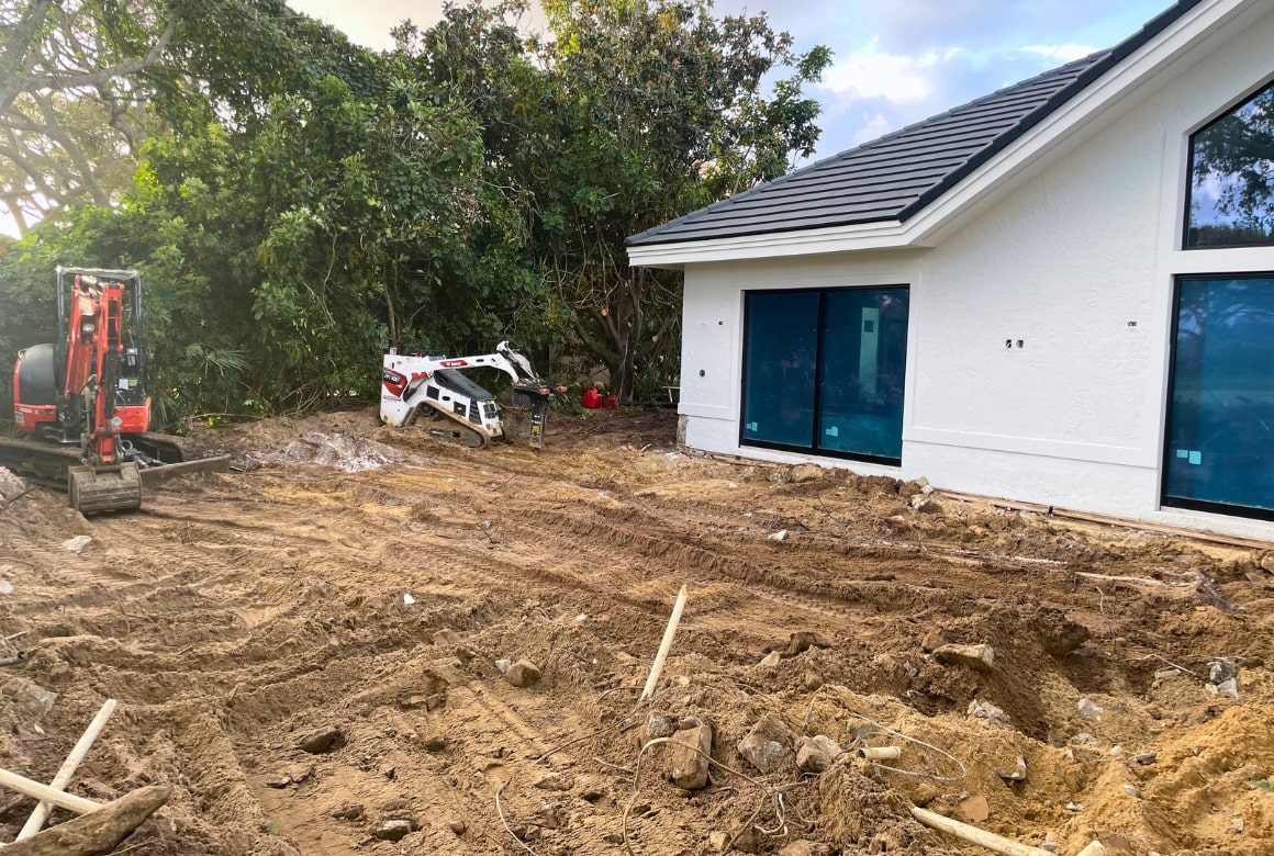 pool deck demo site solutions during image with graded land and machinery